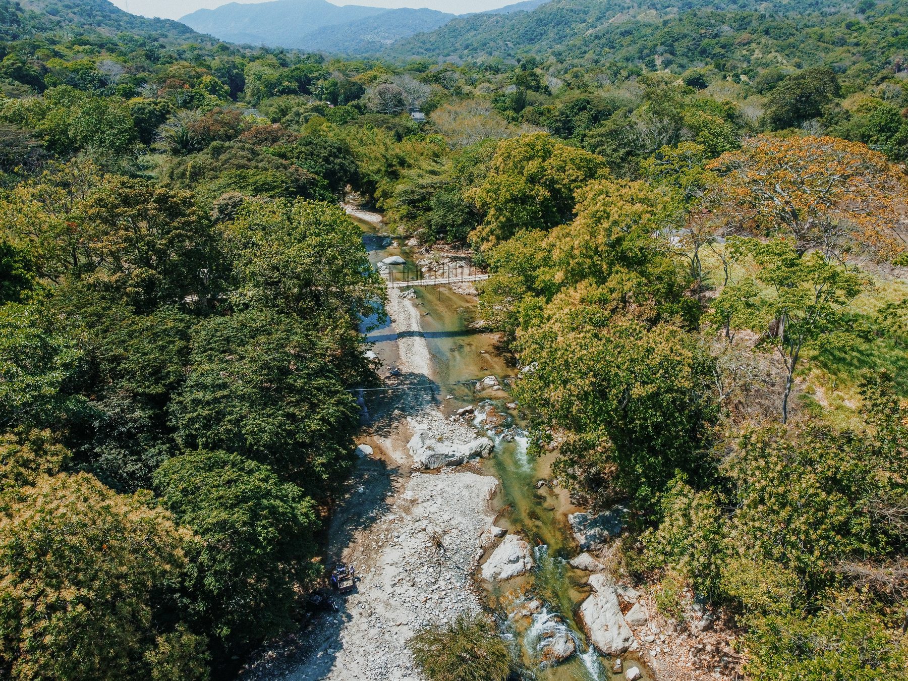 The Río Piedras winding through the forest below the Sierra Nevada